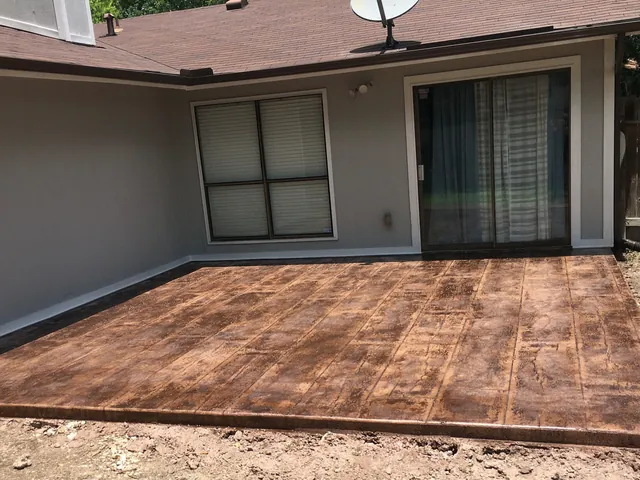 Stamped concrete finished to look like wide timber planks